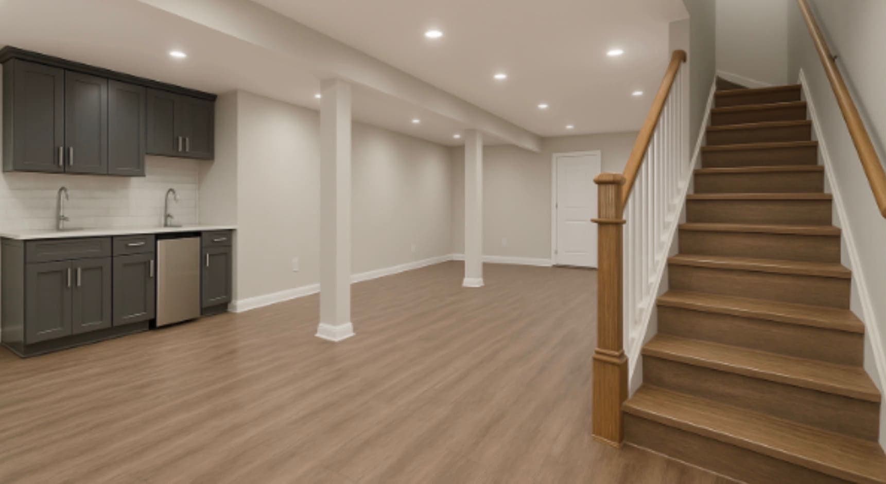 Finished basement with a wet bar, plank flooring and a staircase to the main floor